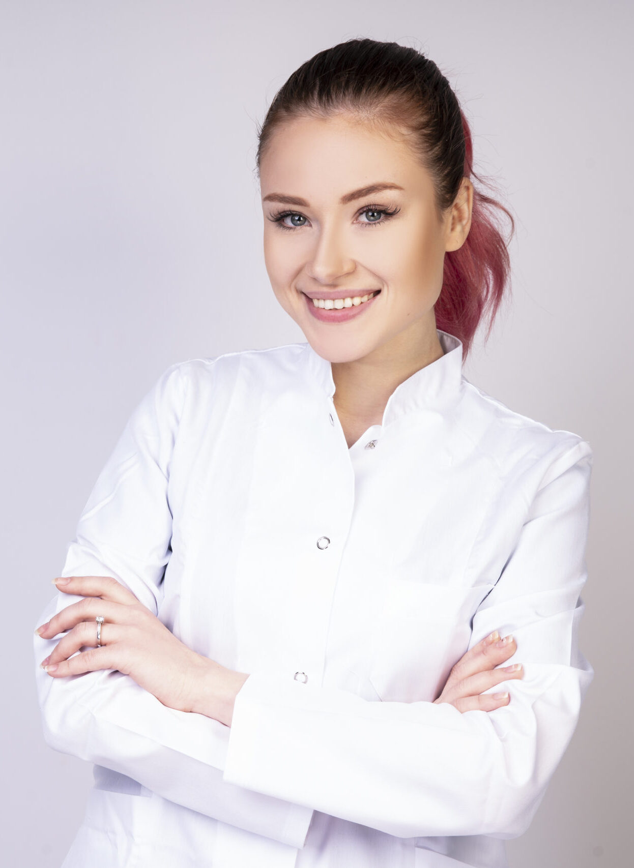 smiling girl in white doctor uniform